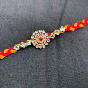 Pearl Zircon Rakhi with Red & Yellow Braided Thread