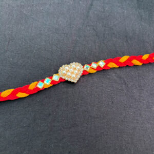 Pearl Heart Rakhi with Red & Yellow Braided Thread